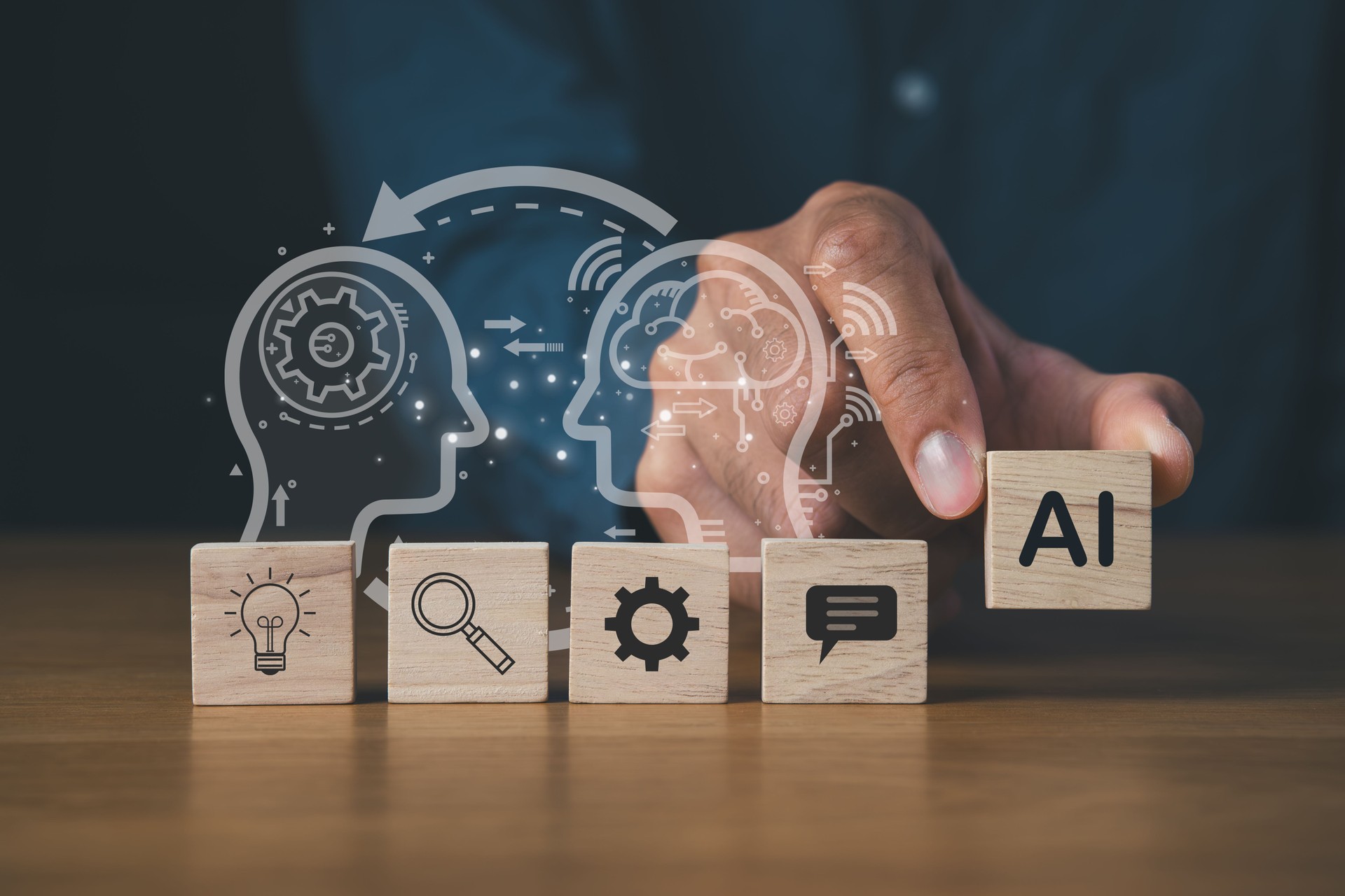 Businessman holding wooden block of AI icons for Futuristic Innovation with Robot AI artificial intelligence technology concept